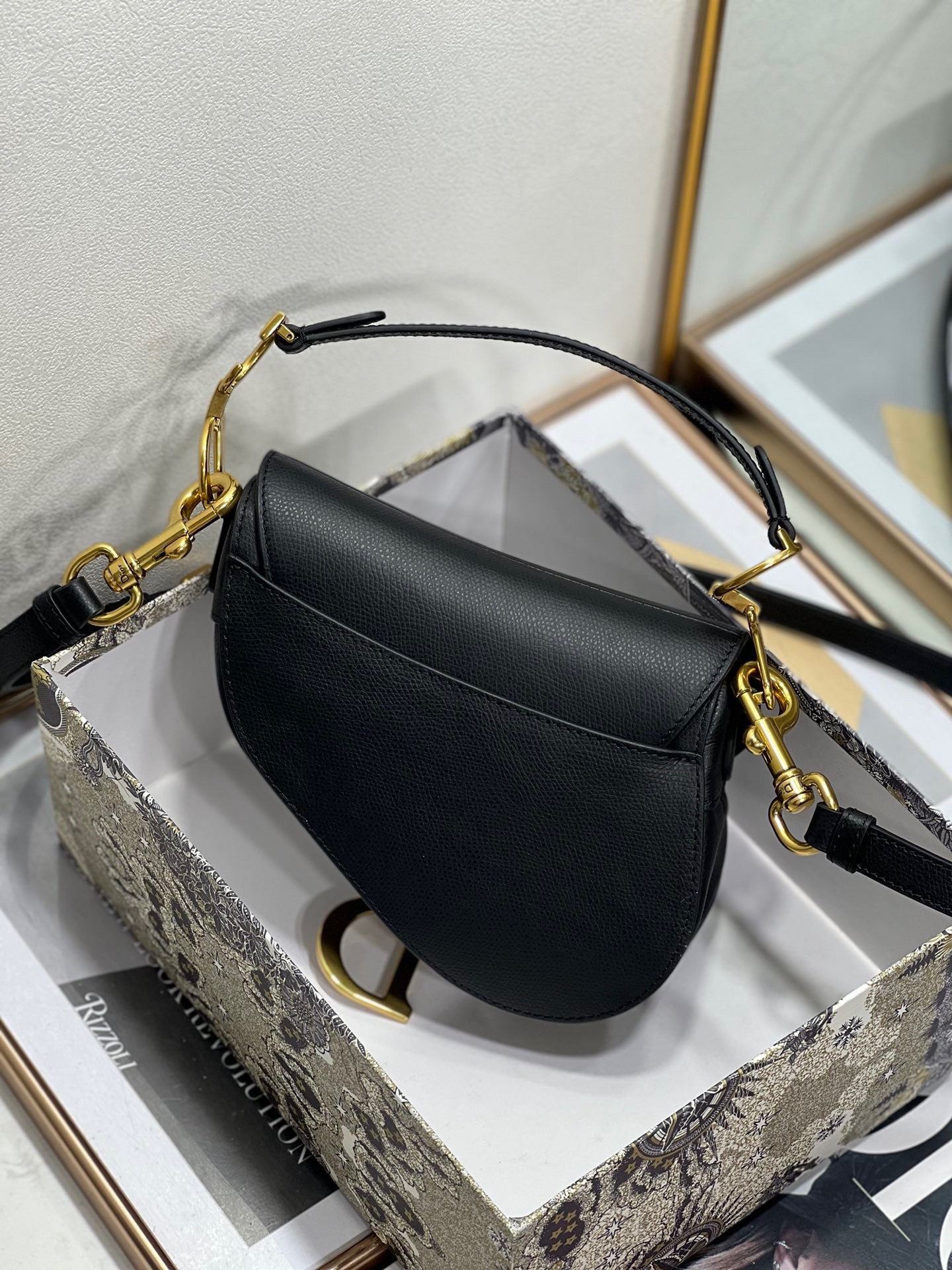 D*or saddle mini bag with strap in black grained calfskin