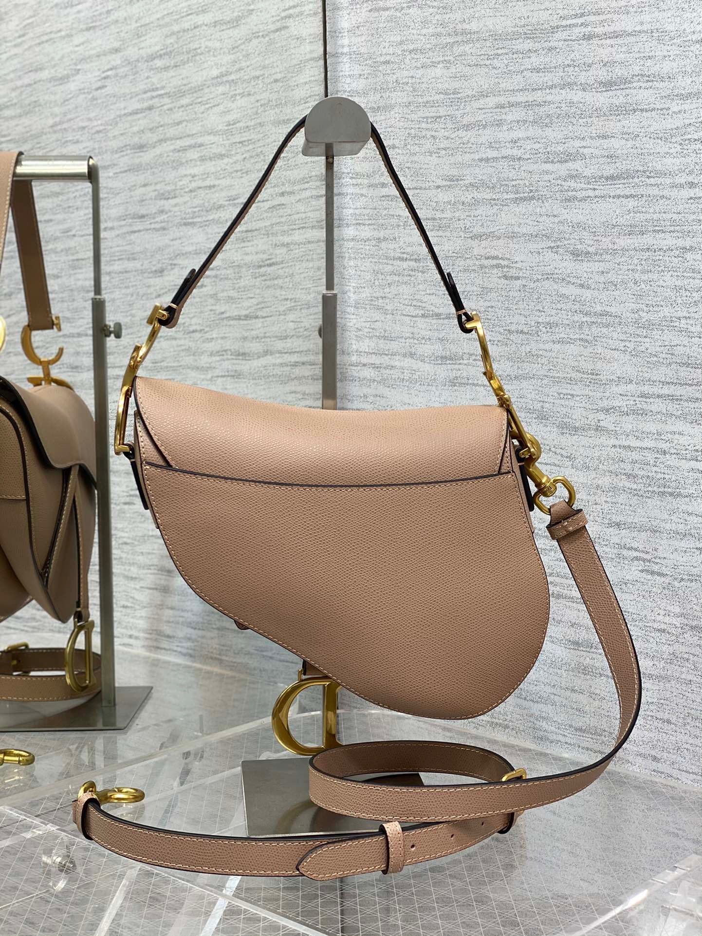D*or saddle bag with strap in blush grained calfskin