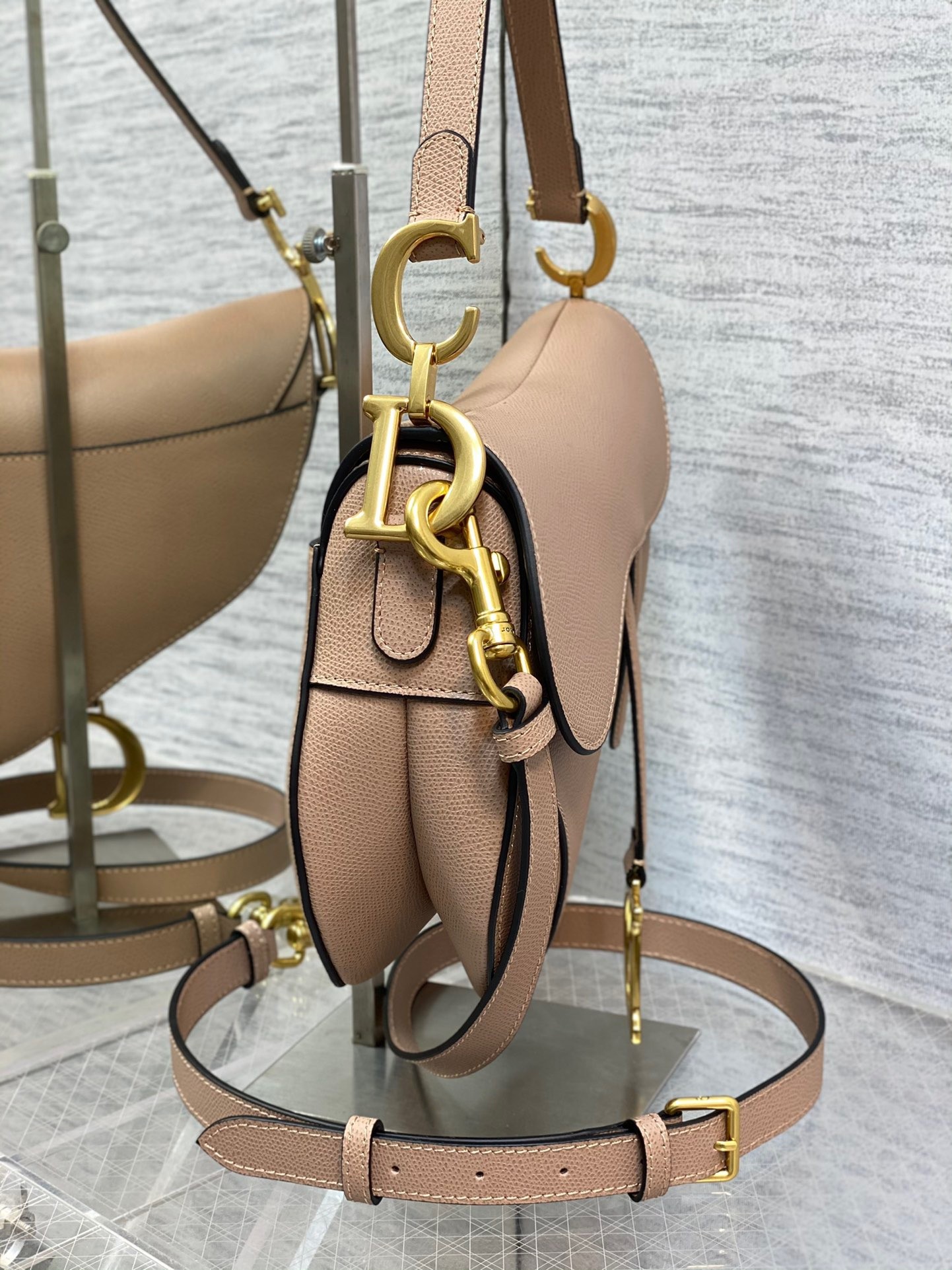 D*or saddle bag with strap in blush grained calfskin
