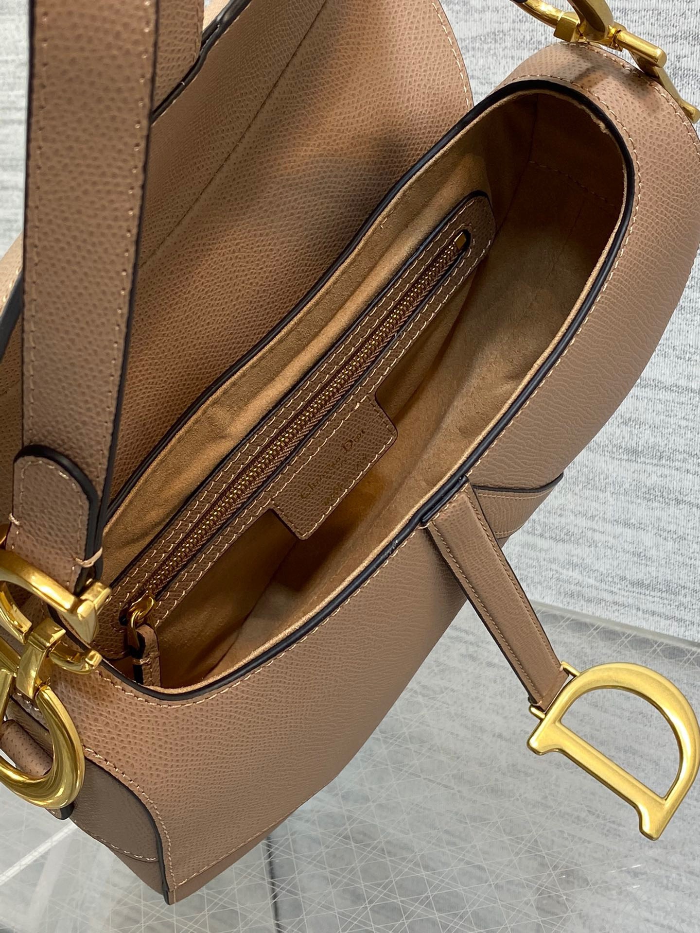 D*or saddle bag with strap in blush grained calfskin