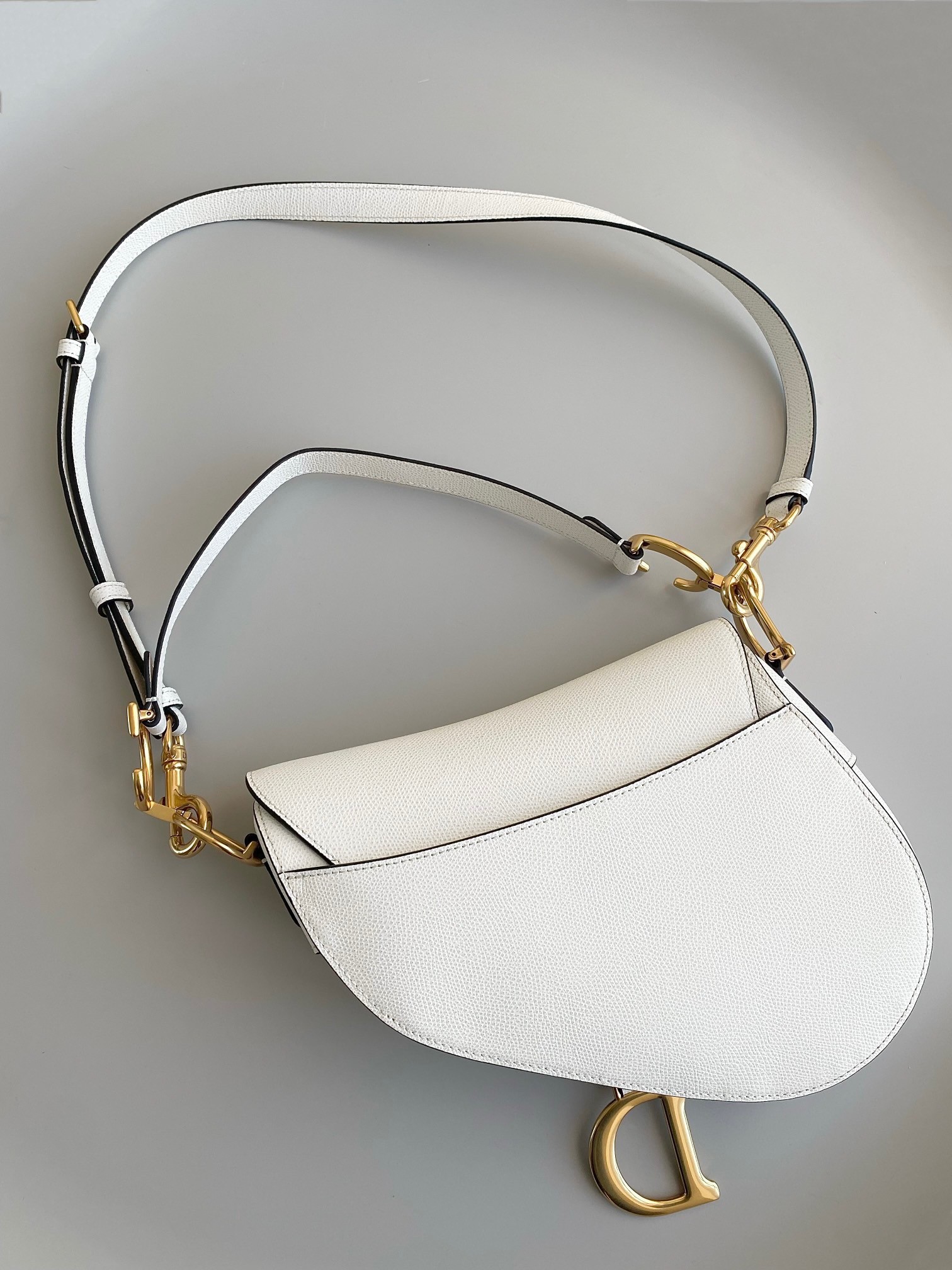 D*or saddle bag with strap in white grained calfskin