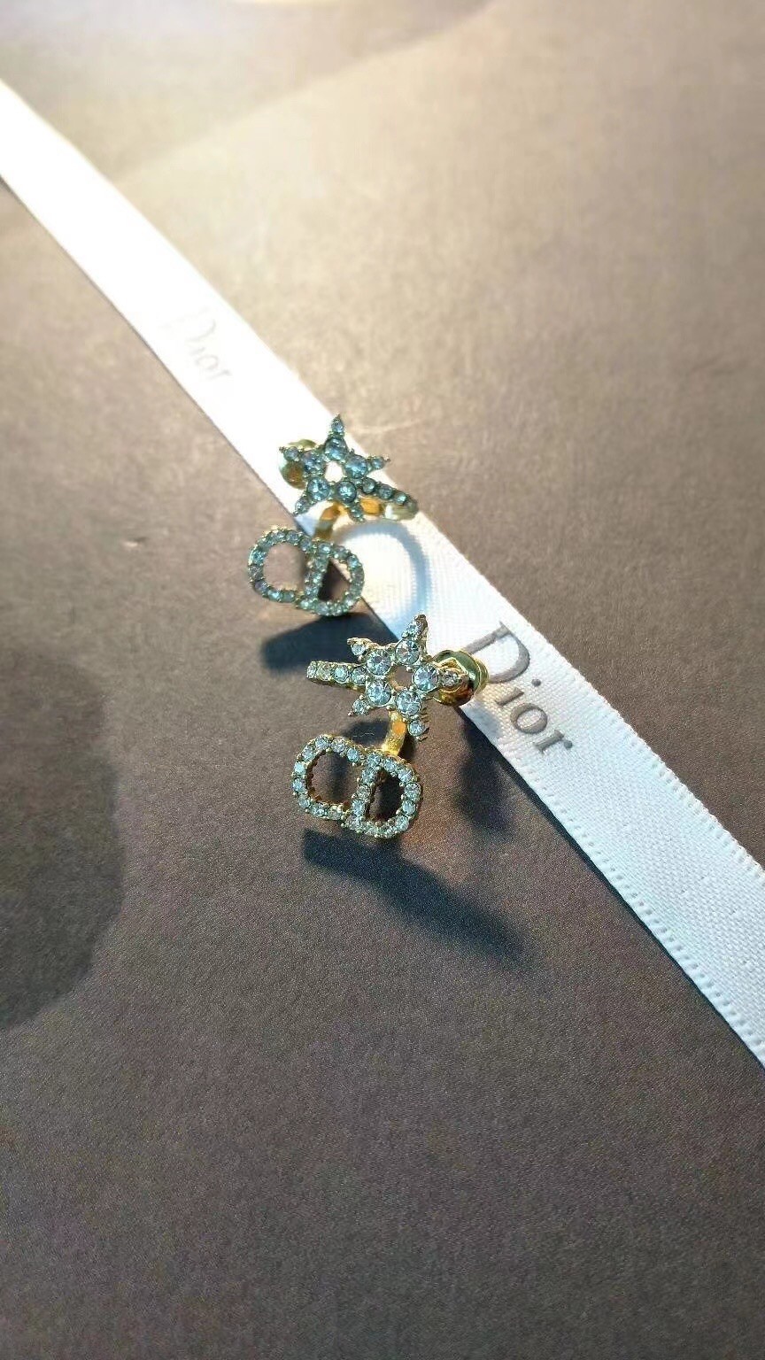 D*or clair d lune earrings in gold-finish metal and white crystals