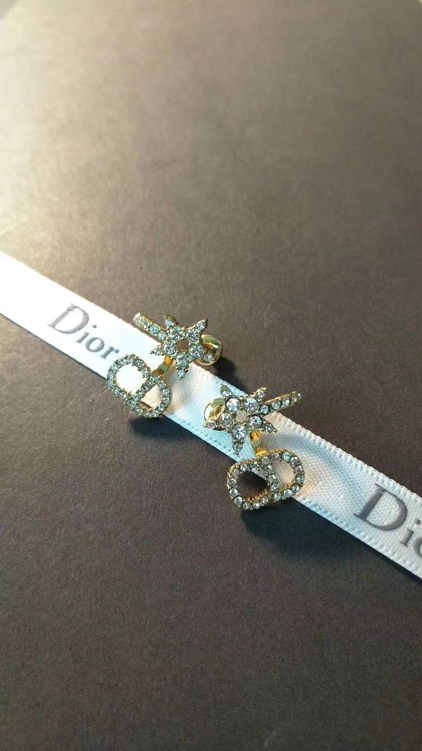 D*or clair d lune earrings in gold-finish metal and white crystals