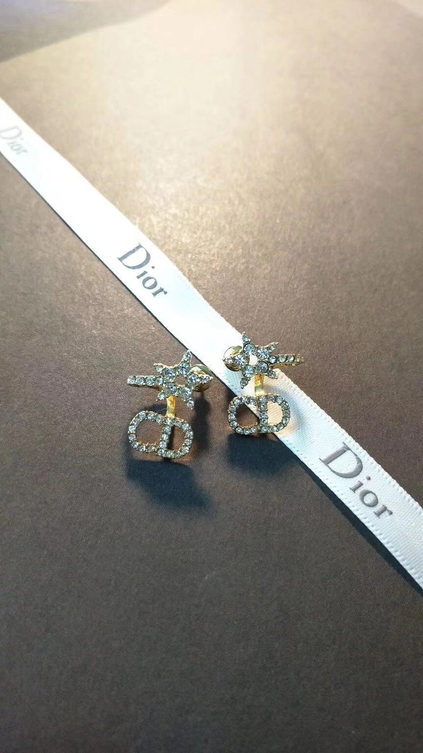 D*or clair d lune earrings in gold-finish metal and white crystals