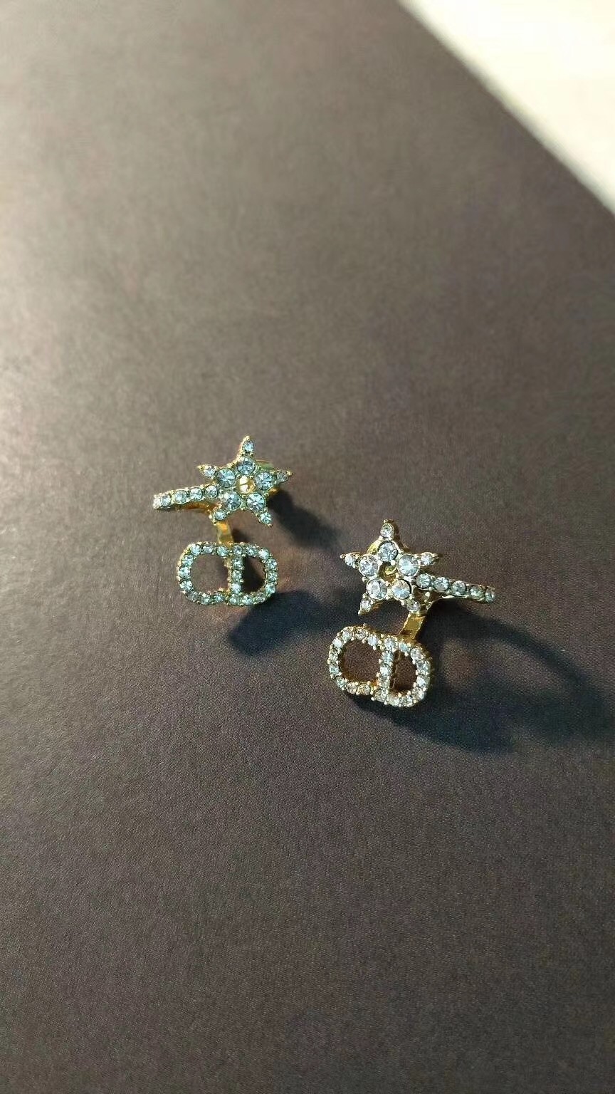 D*or clair d lune earrings in gold-finish metal and white crystals