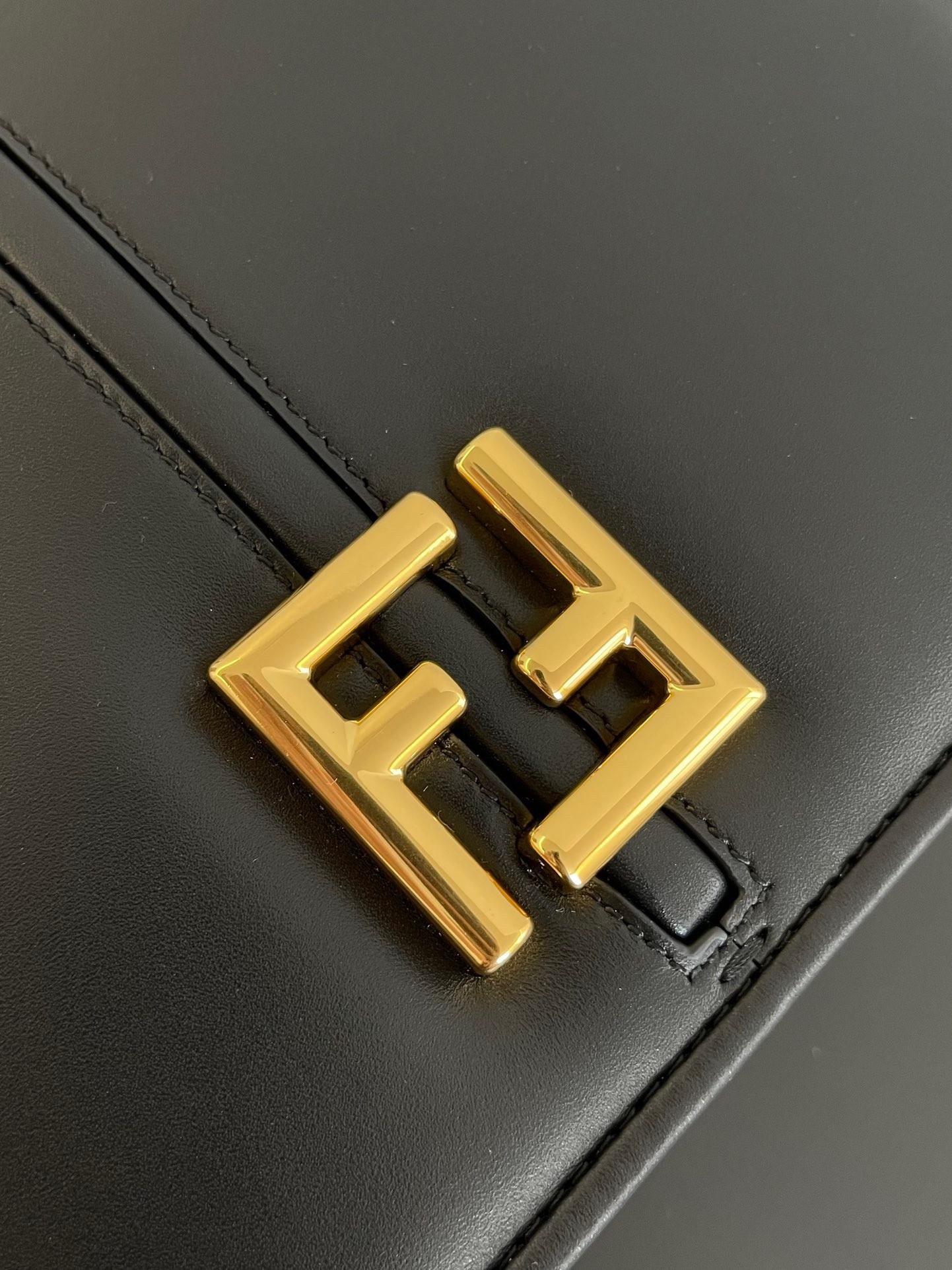 F**di c’mon medium bag in black calfskin
