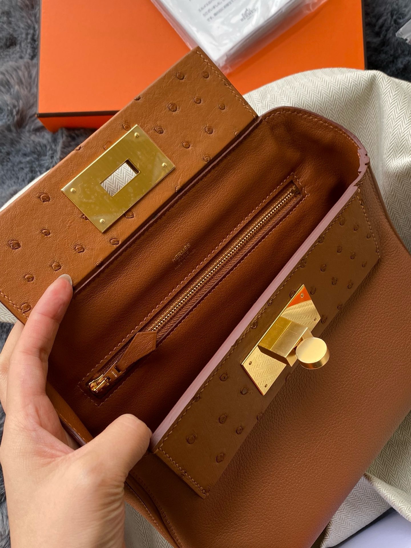 H**mes 24/24 mini 21 touch bag in gold evercolor and ostrich leather