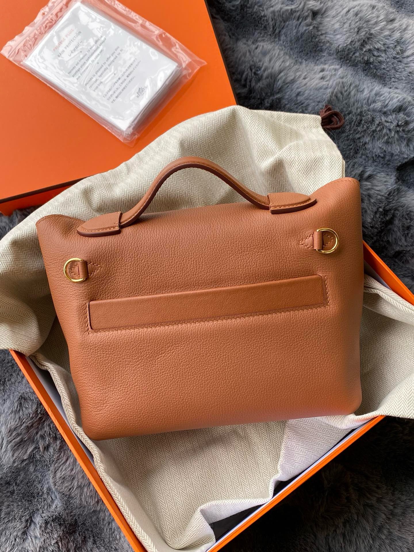 H**mes 24/24 mini 21 touch bag in gold evercolor and ostrich leather