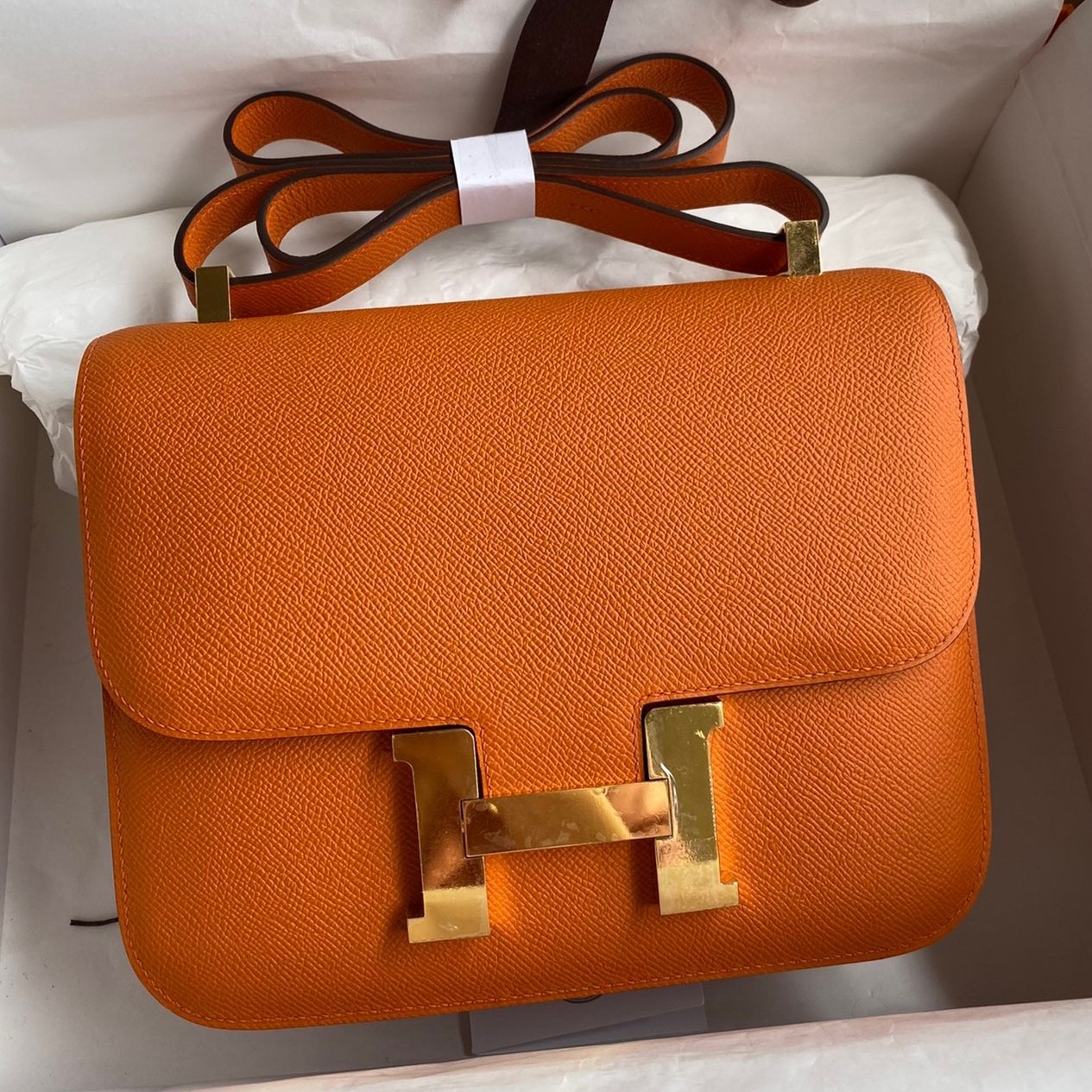H**mes constance 24 handmade bag in orange epsom calfskin
