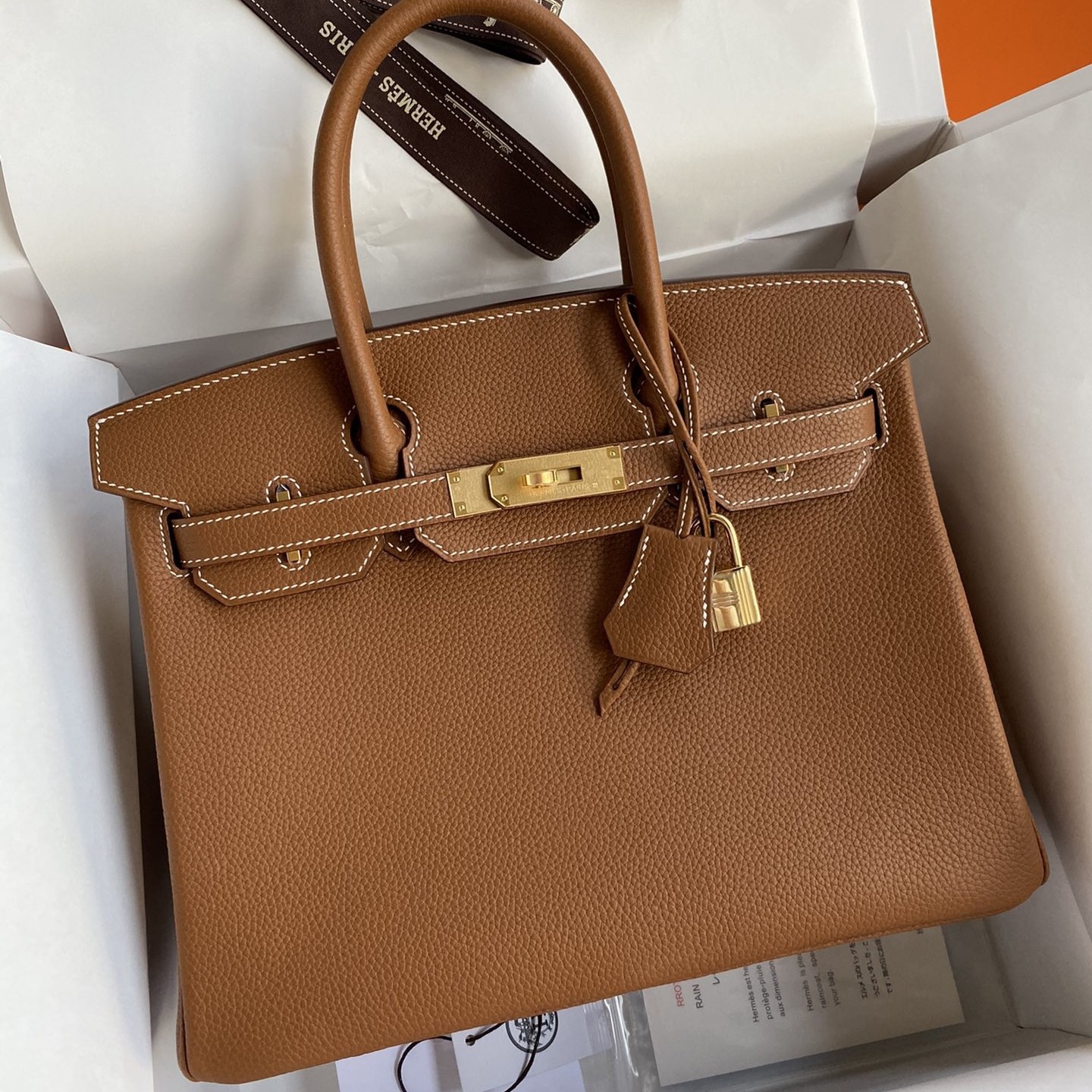 H**mes birkin 30 retourne handmade bag in gold clemence leather