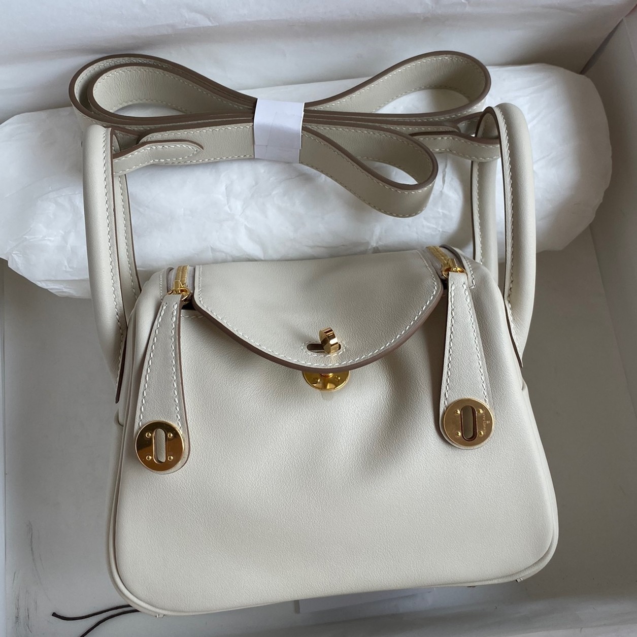 H**mes mini lindy handmade bag in craie swift leather