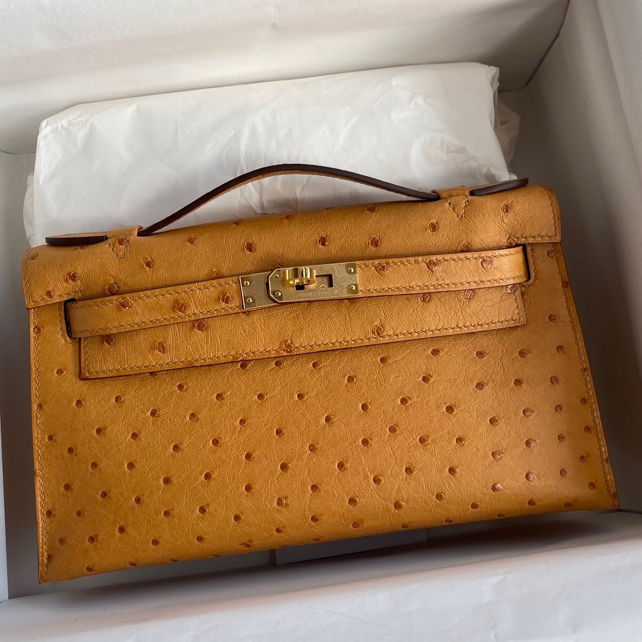 H**mes kelly pochette handmade bag in sesame ostrich leather