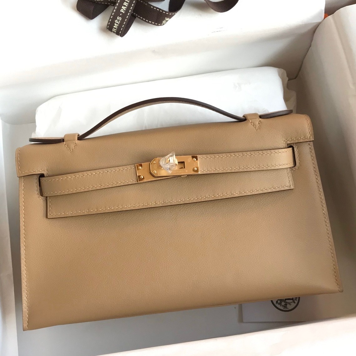 H**mes kelly pochette handmade bag in biscuit swift calfskin