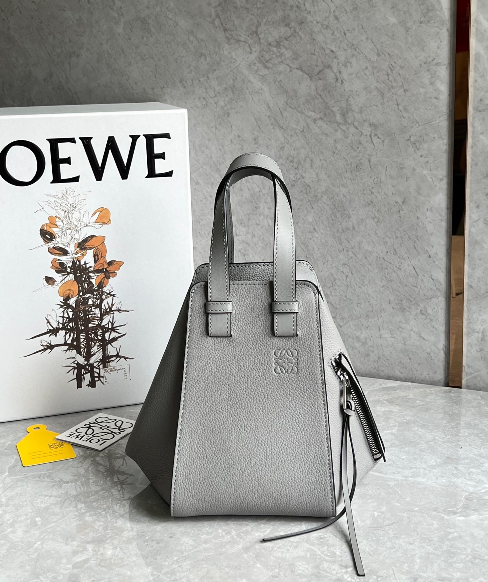 L0ew* compact hammock bag in pearl grey grained calfskin