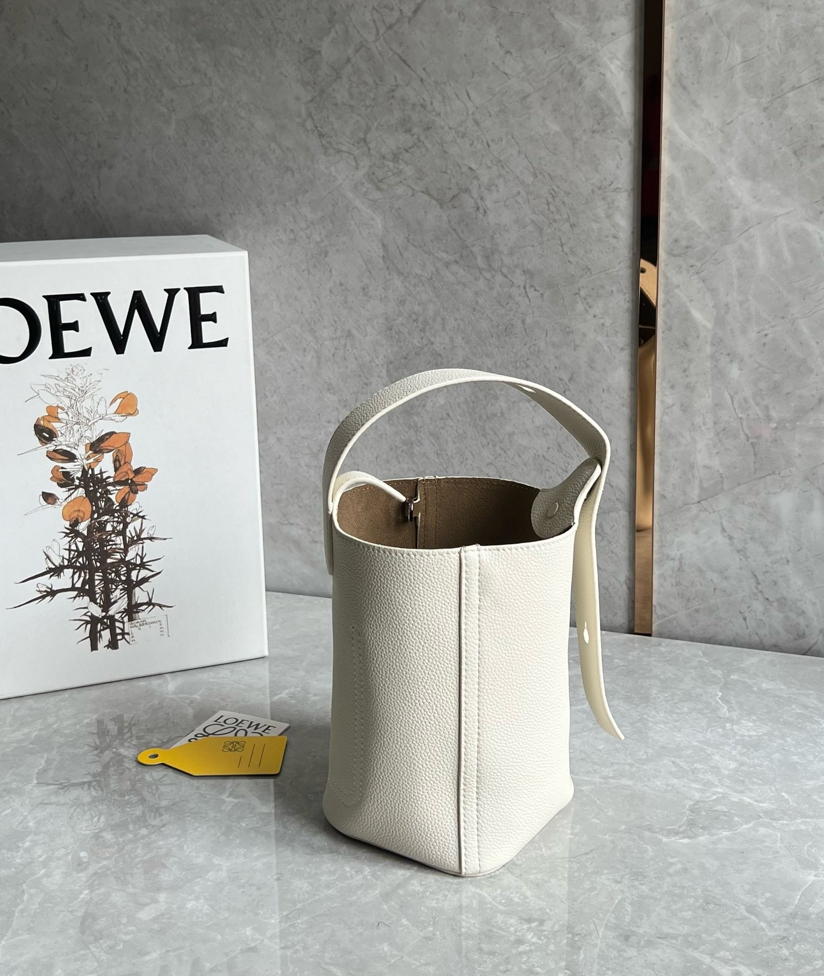 L0ew* mini pebble bucket bag in white grained leather
