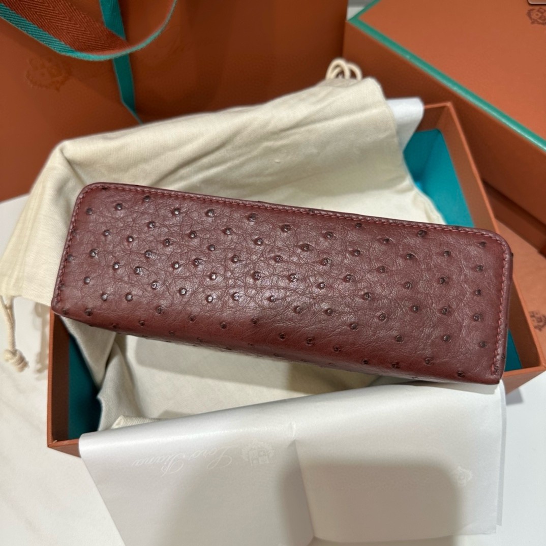 L**o p*ana extra pocket pouch l19 in burgundy ostrich-embossed leather