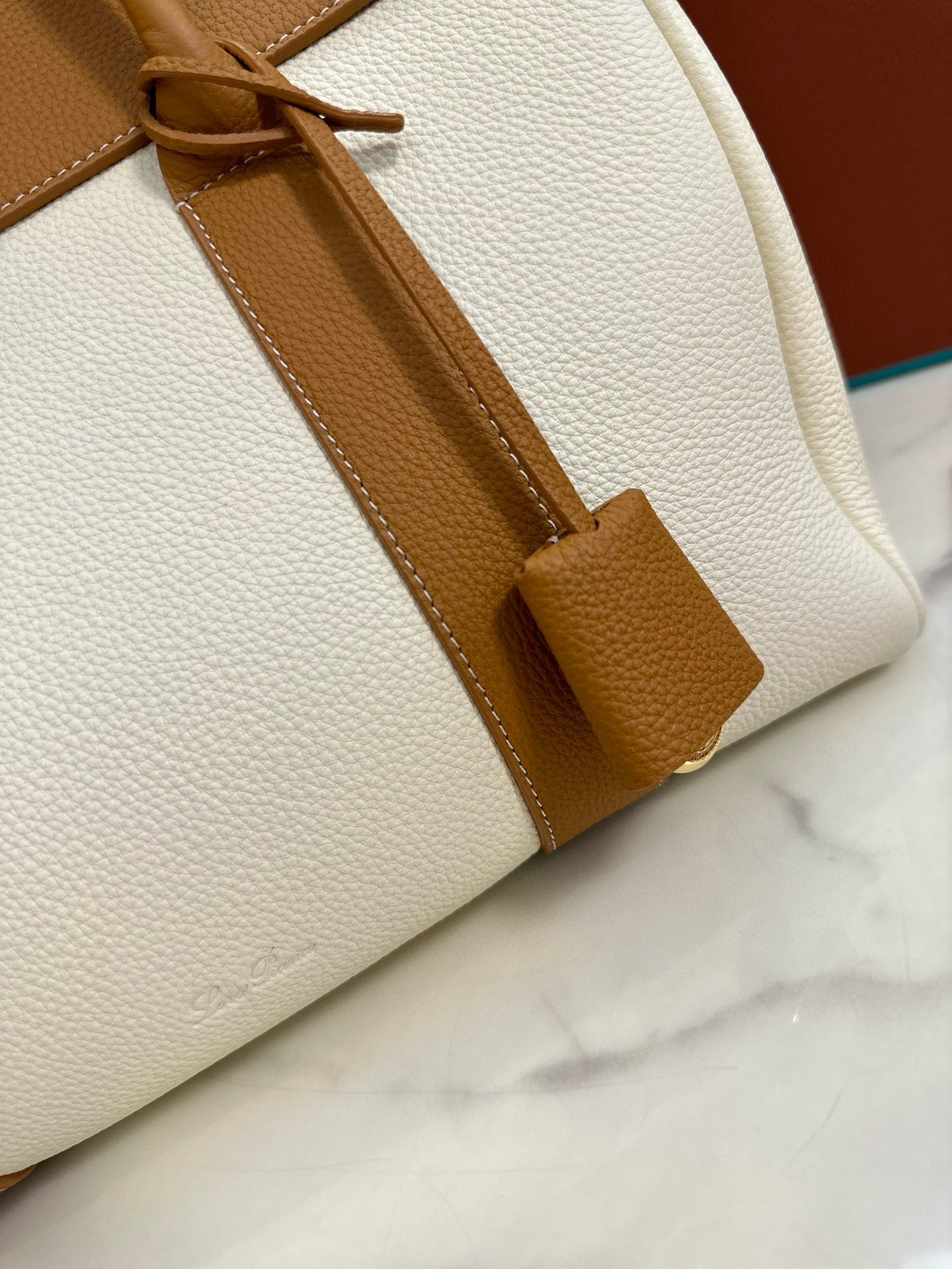 L**o p*ana loom l32 bag in white and tan grained leather