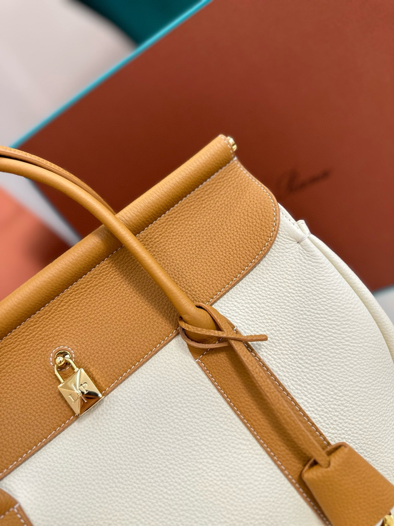 L**o p*ana loom l32 bag in white and tan grained leather