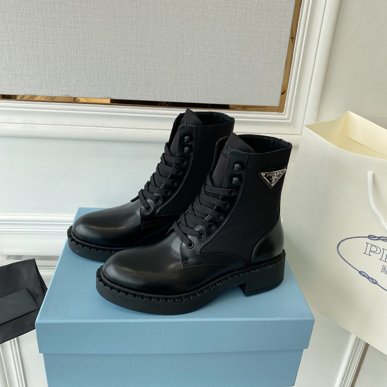 Pra*a ankle boots in black brushed leather and re-nylon