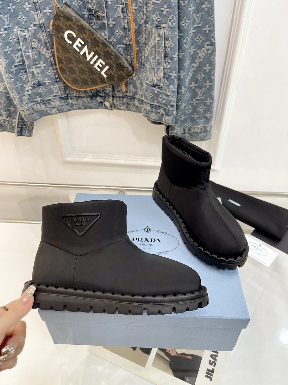 Pra*a booties in black nylon fabric