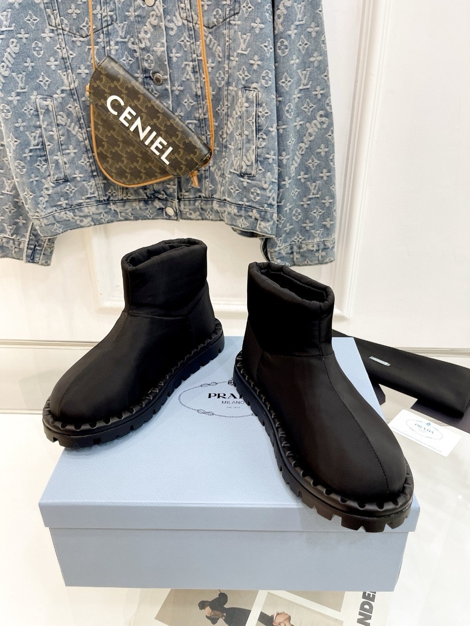Pra*a booties in black nylon fabric