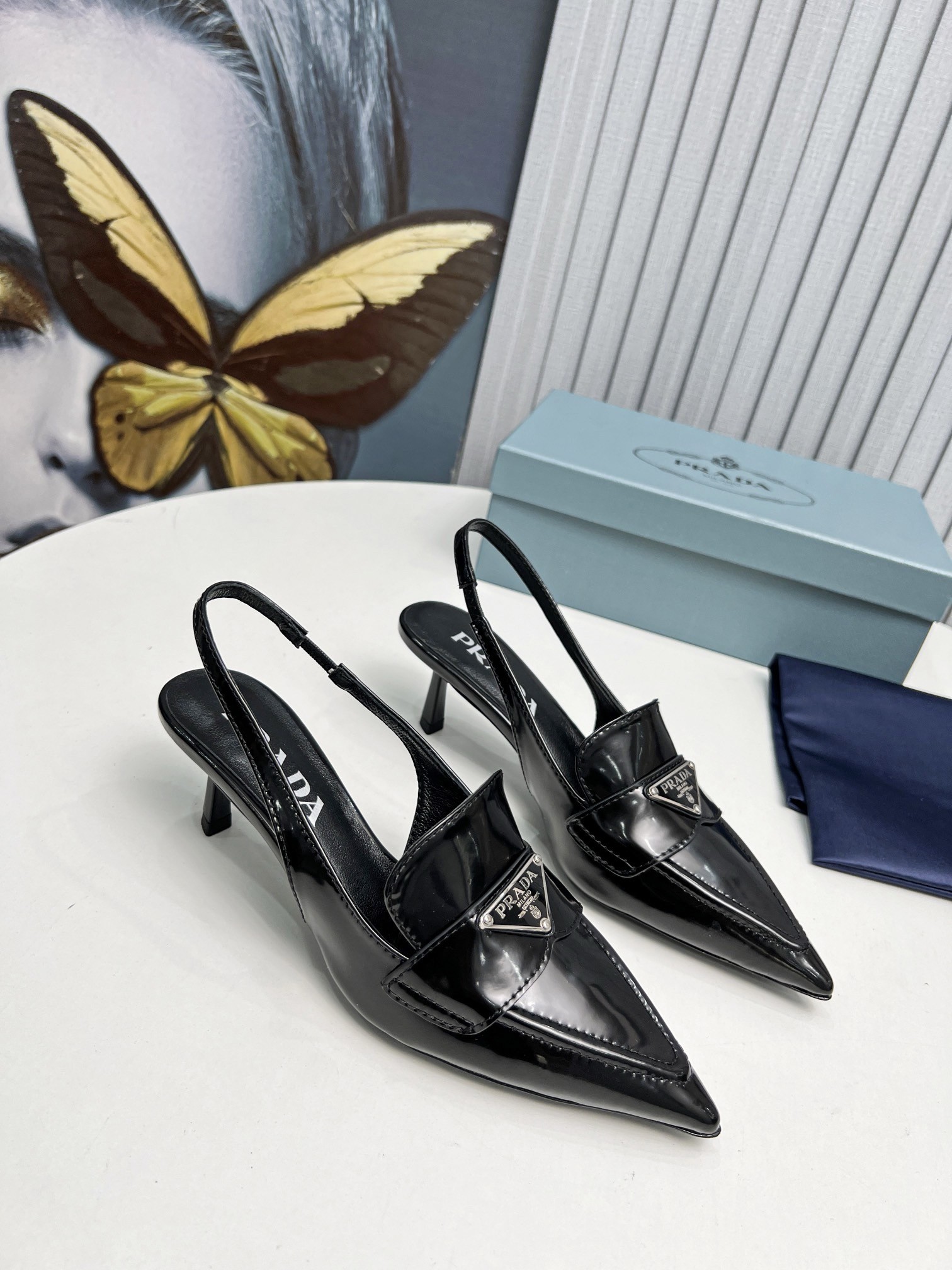 Pra*a slingback pumps 45mm in black patent calfskin