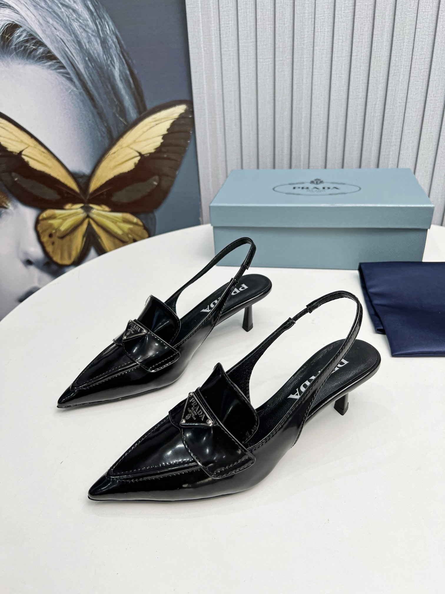 Pra*a slingback pumps 45mm in black patent calfskin