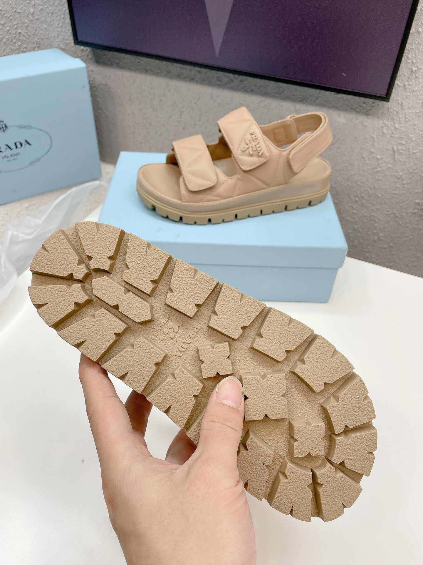 Pra*a padded sandals in beige nappa leather
