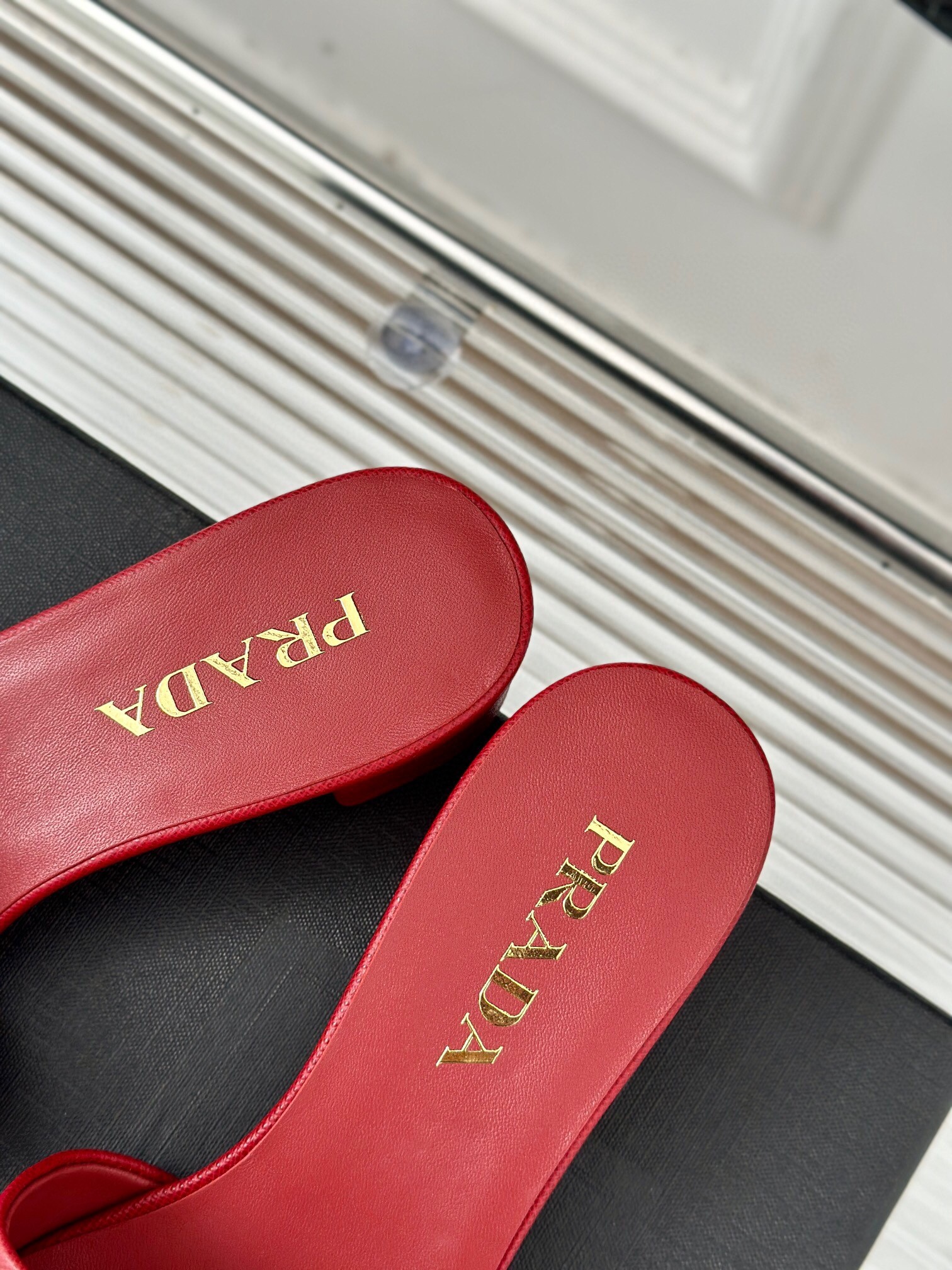 Pra*a heeled sandals 35mm in red saffiano leather