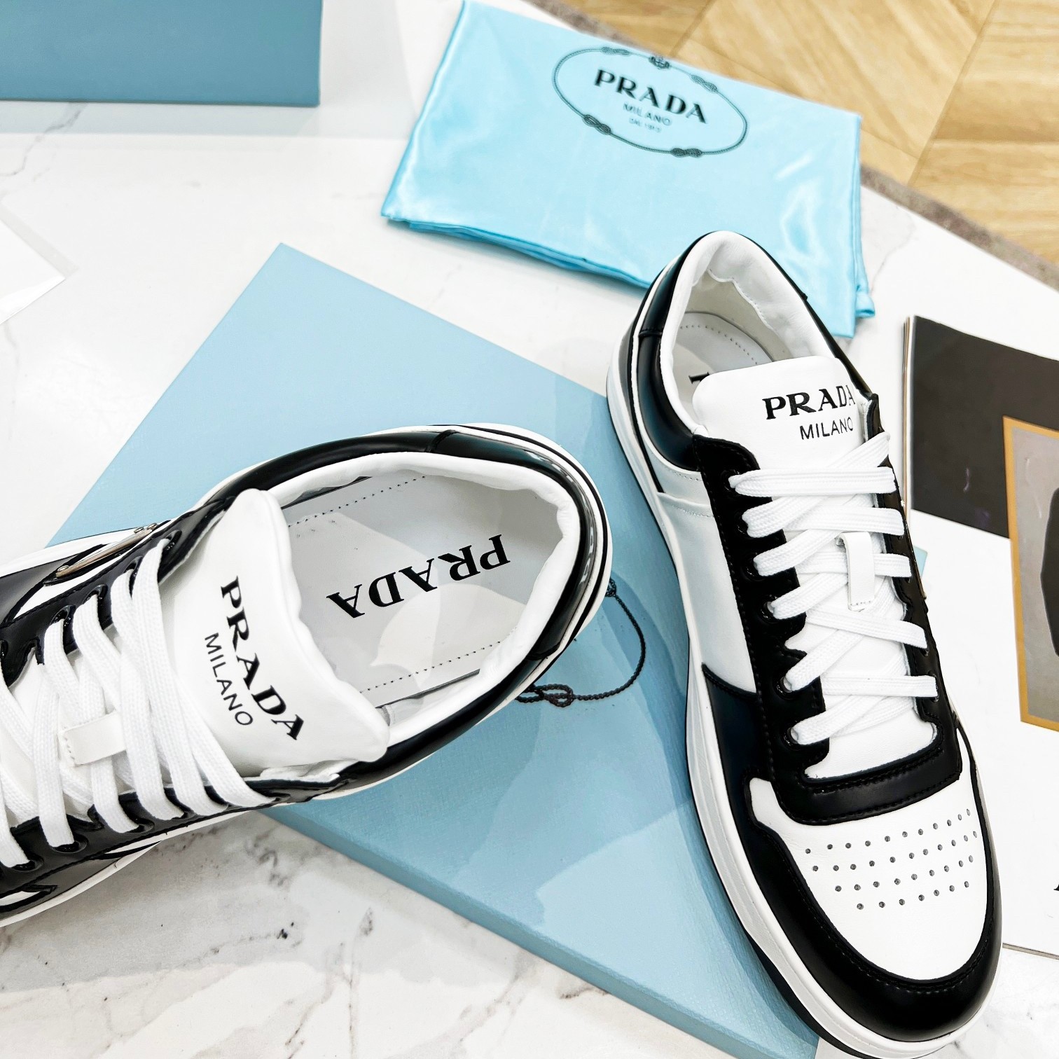 Pra*a downtown sneakers in white and black calfskin