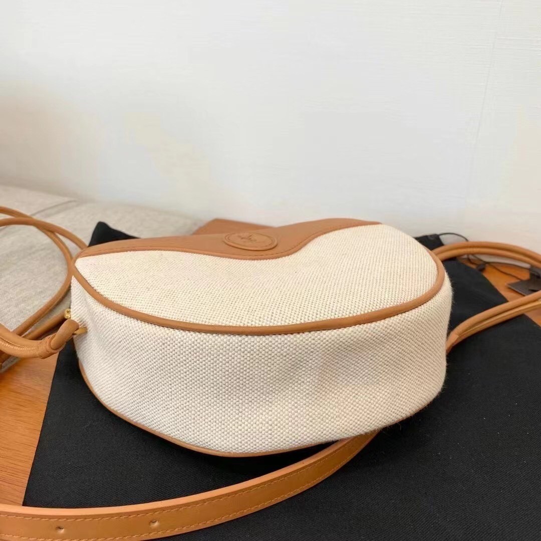 Sa**t Lau*nt monogramme sac cœur bag in canvas