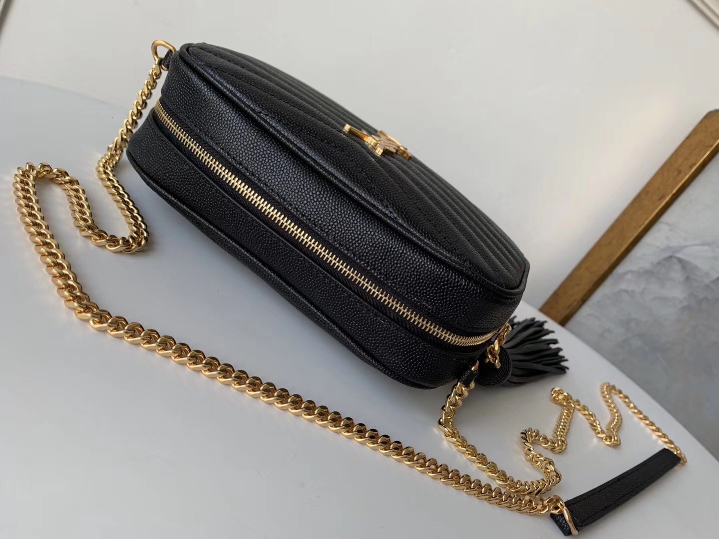 Sa**t Lau*nt lou mini bag in black grained leather