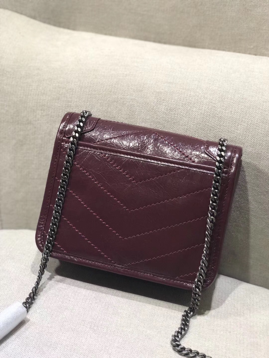 Sa**t Lau*nt woc niki chain wallet in bordeaux crinkled leather