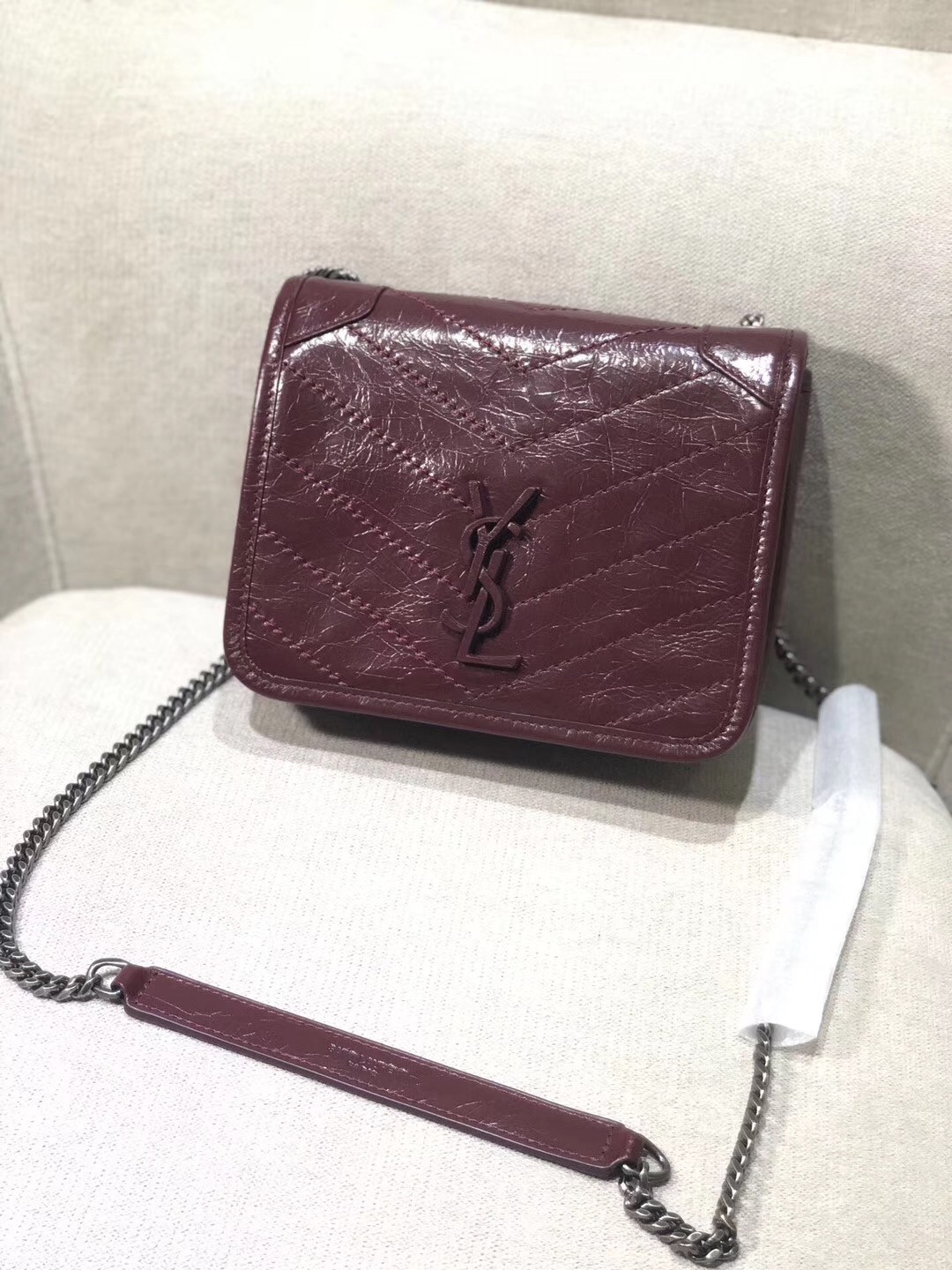 Sa**t Lau*nt woc niki chain wallet in bordeaux crinkled leather