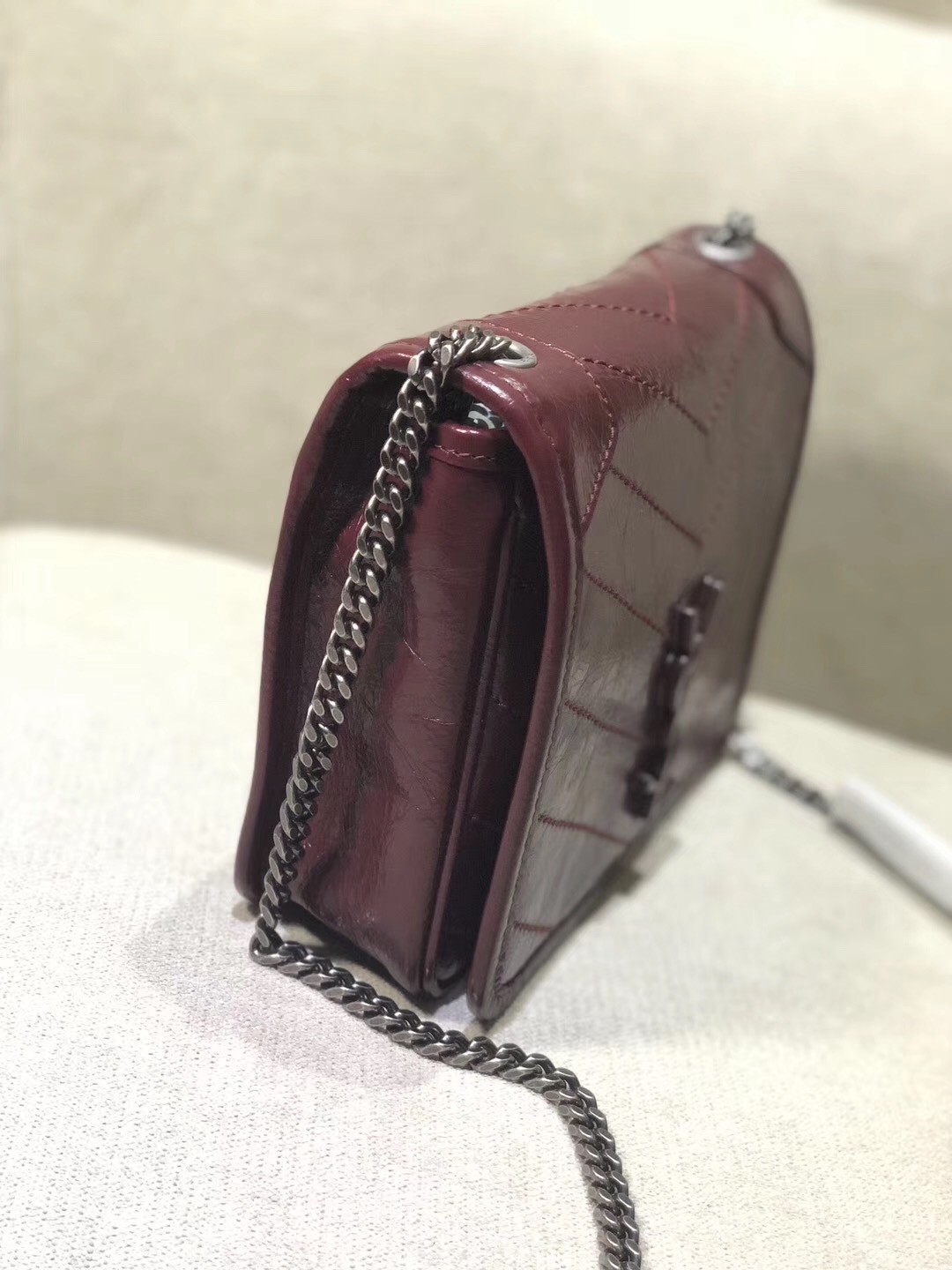 Sa**t Lau*nt woc niki chain wallet in bordeaux crinkled leather