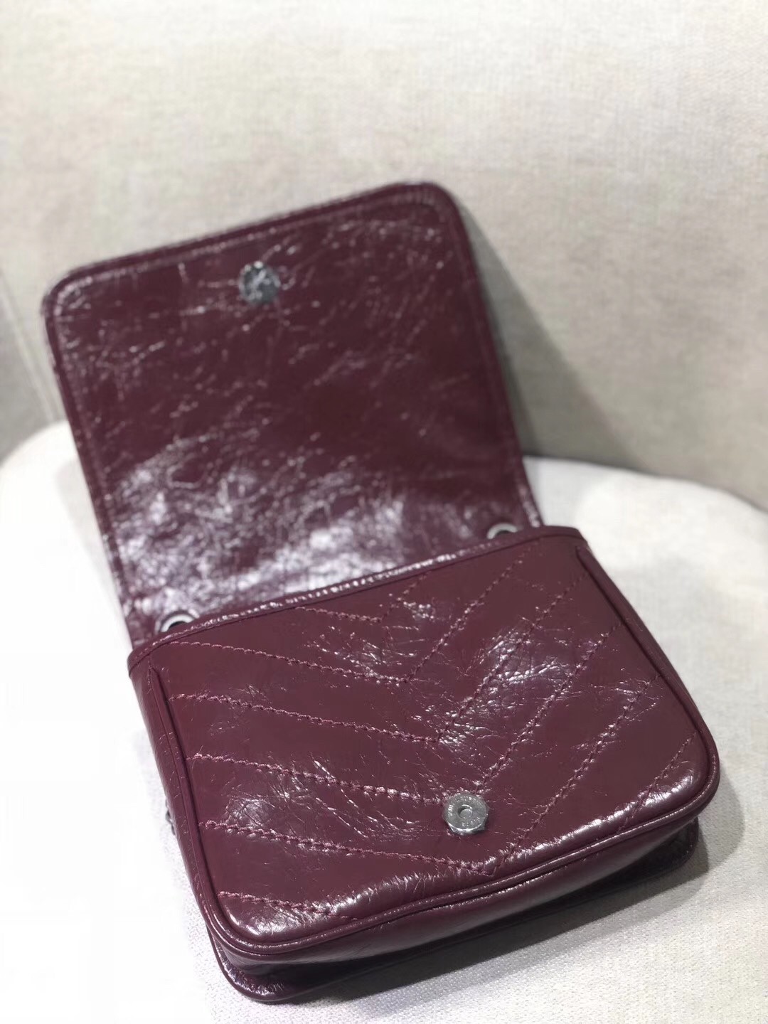Sa**t Lau*nt woc niki chain wallet in bordeaux crinkled leather