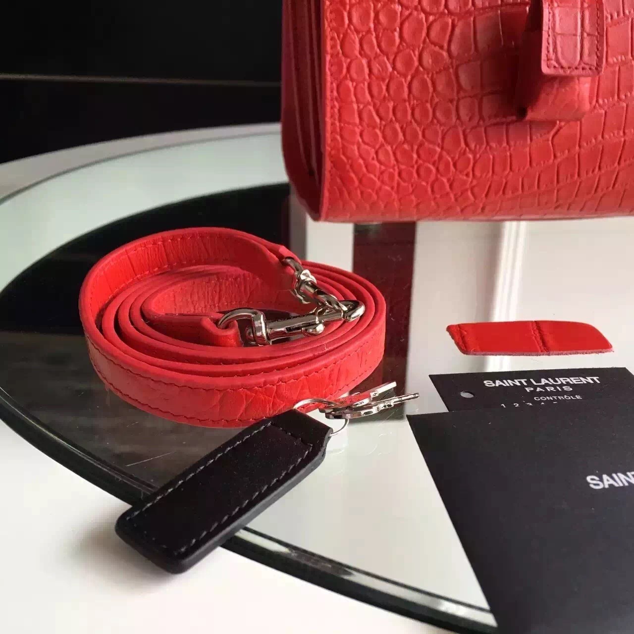 Sa**t Lau*nt small sac de jour bag in red crocodile leather