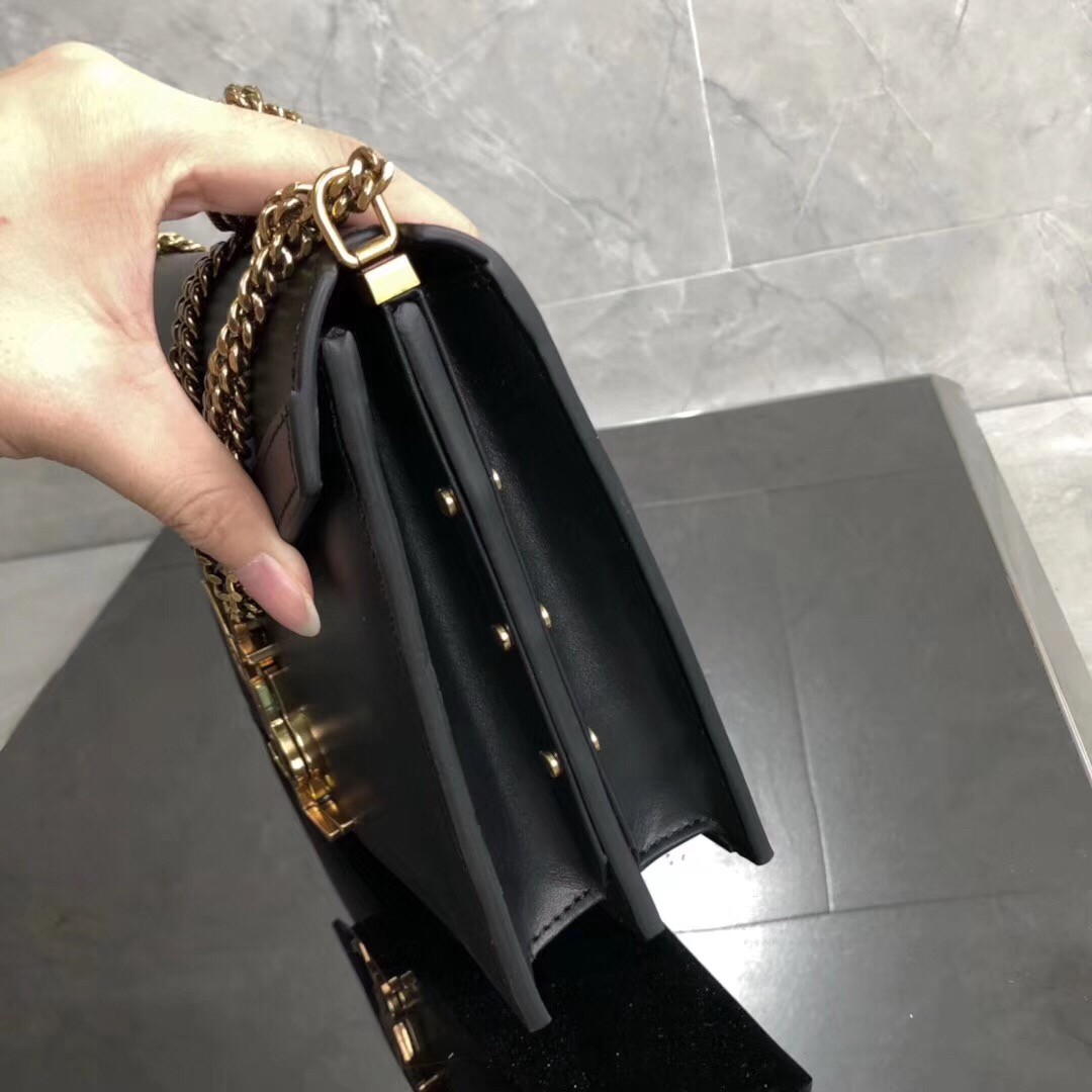 Sa**t Lau*nt black cassandra monogram clasp bag