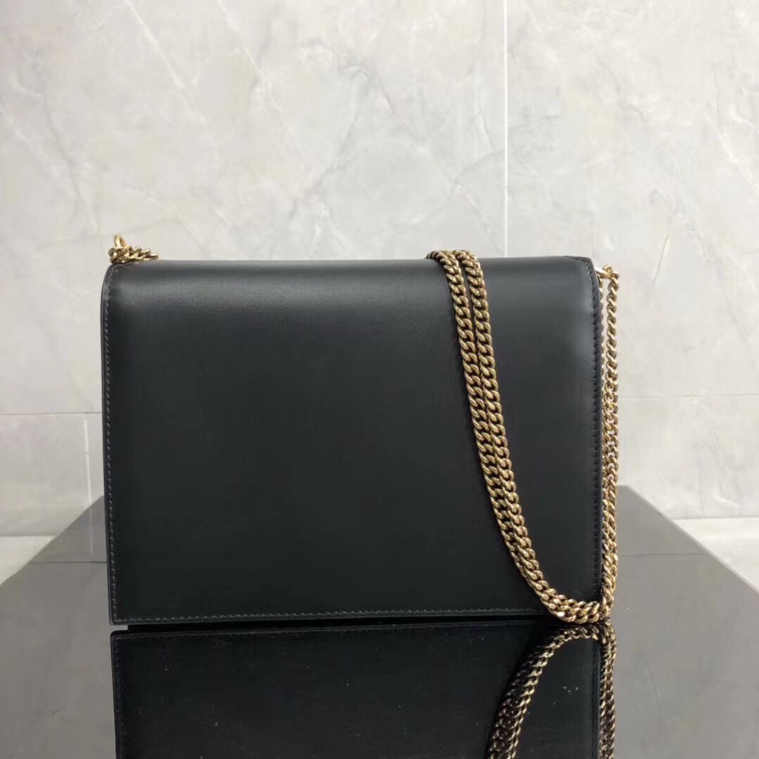 Sa**t Lau*nt black cassandra monogram clasp bag