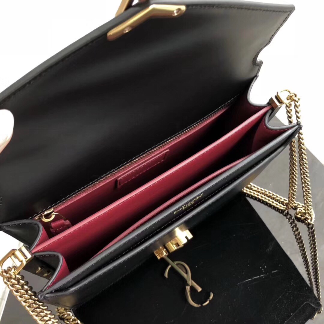Sa**t Lau*nt black cassandra monogram clasp bag