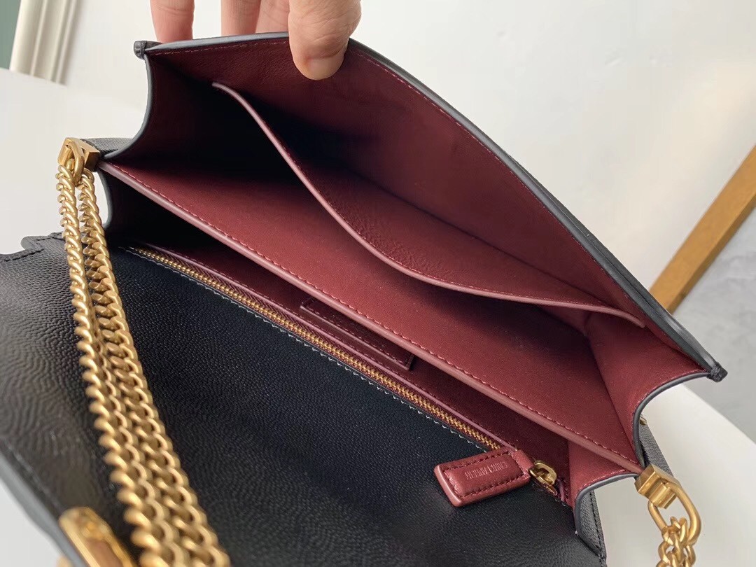 Sa**t Lau*nt cassandra clasp bag in black grained leather