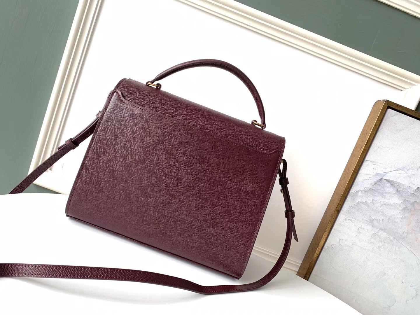 Sa**t Lau*nt cassandra medium bag in bordeaux grained leather