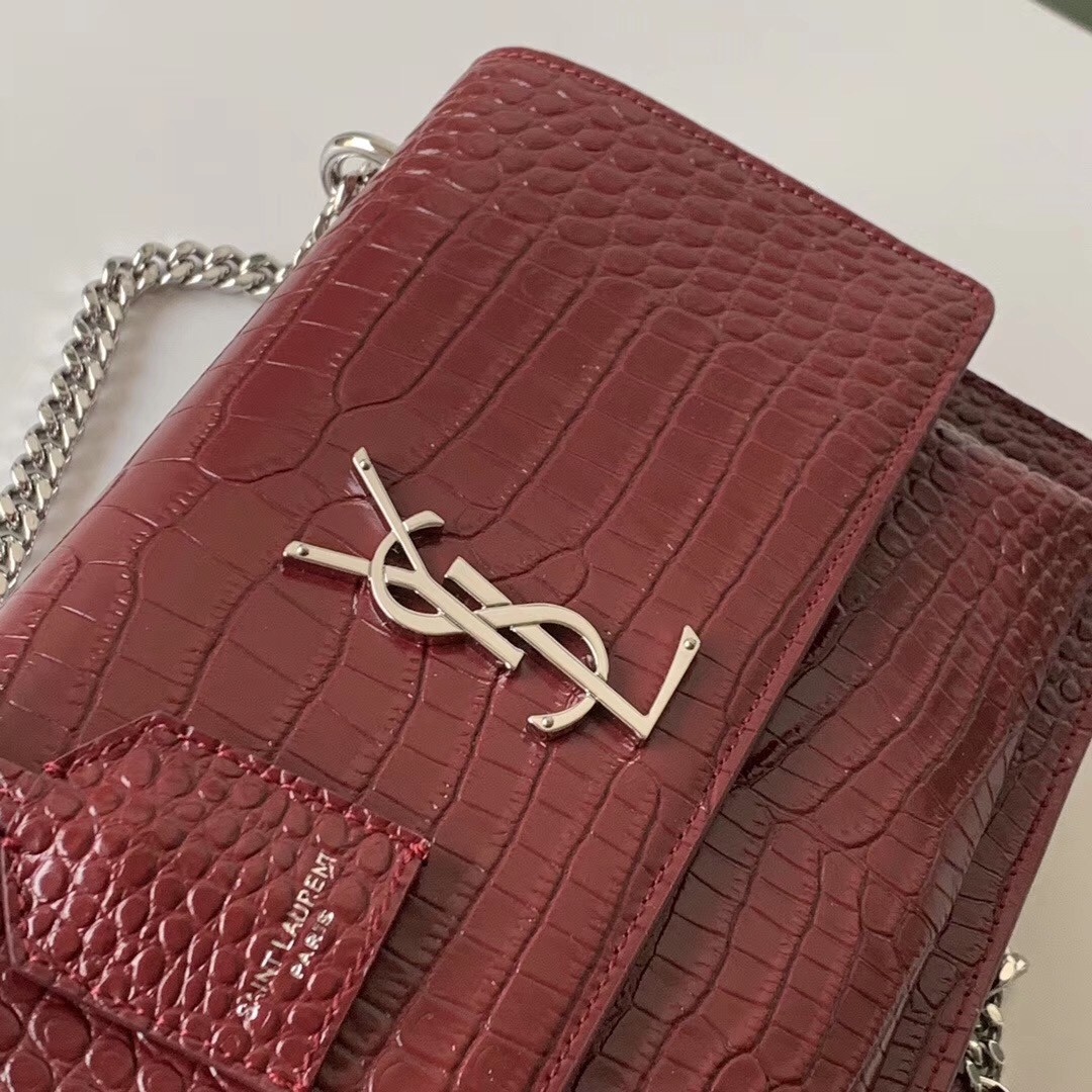 Sa**t Lau*nt sunset medium bag in bordeaux crocodile embossed leather