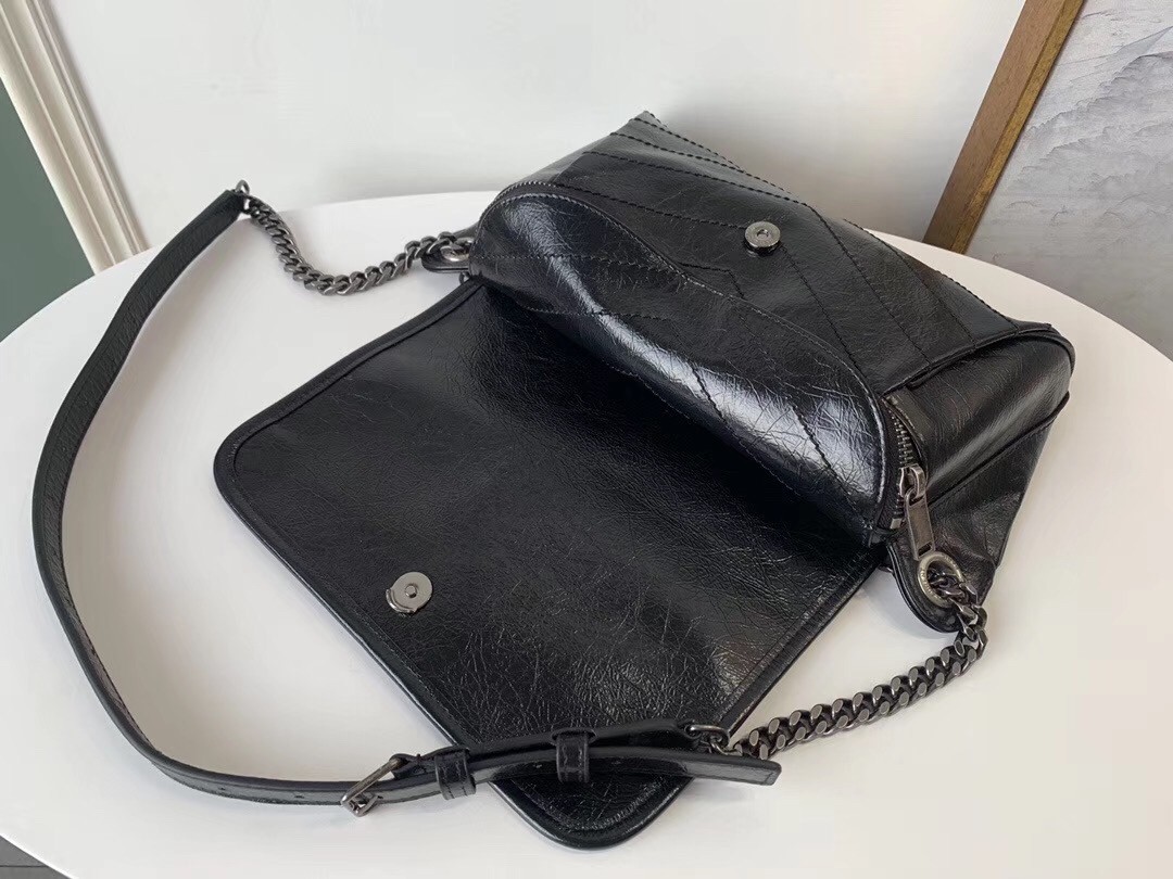 Sa**t Lau*nt niki body bag in black crinkled vintage leather