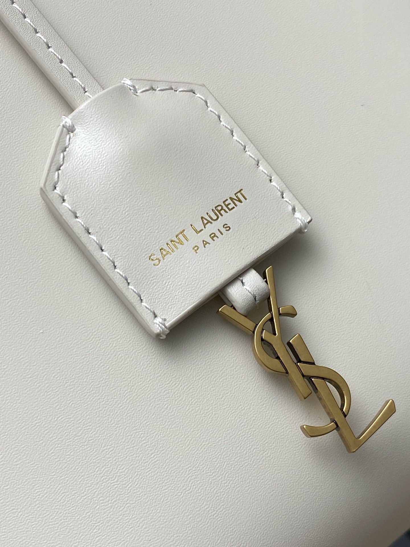 Sa**t Lau*nt mini toy shopping bag in white calfskin